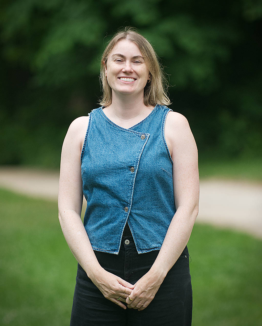 Caitie Rossman wearing blue denim vest